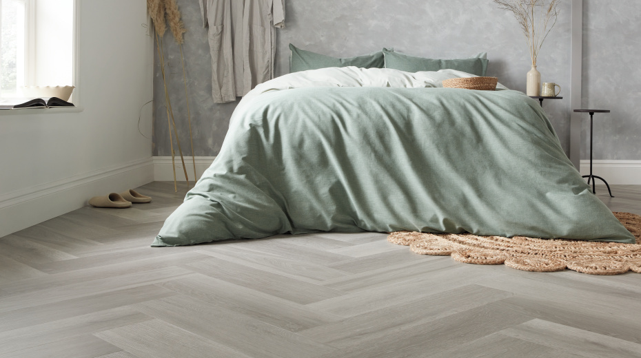 Karndean texas white ash herringbone wood flooring in a bedroom